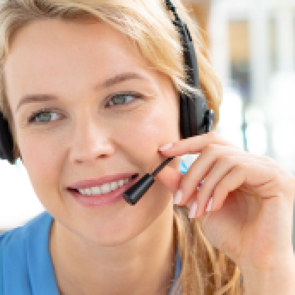 Female customer service executive talking on headset in a modern office